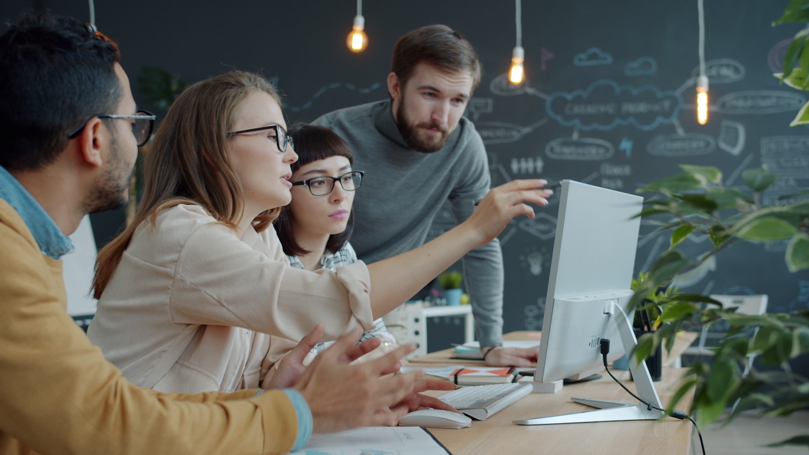 A team reviewing leads together on a laptop